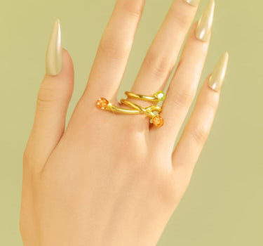 Goldener asymmetrischer Ring mit Opal- und Topas-Kristallen