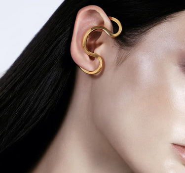 ear cuff around the ear in gold