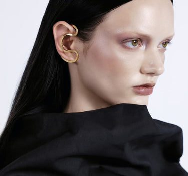 ear cuff around the ear in gold